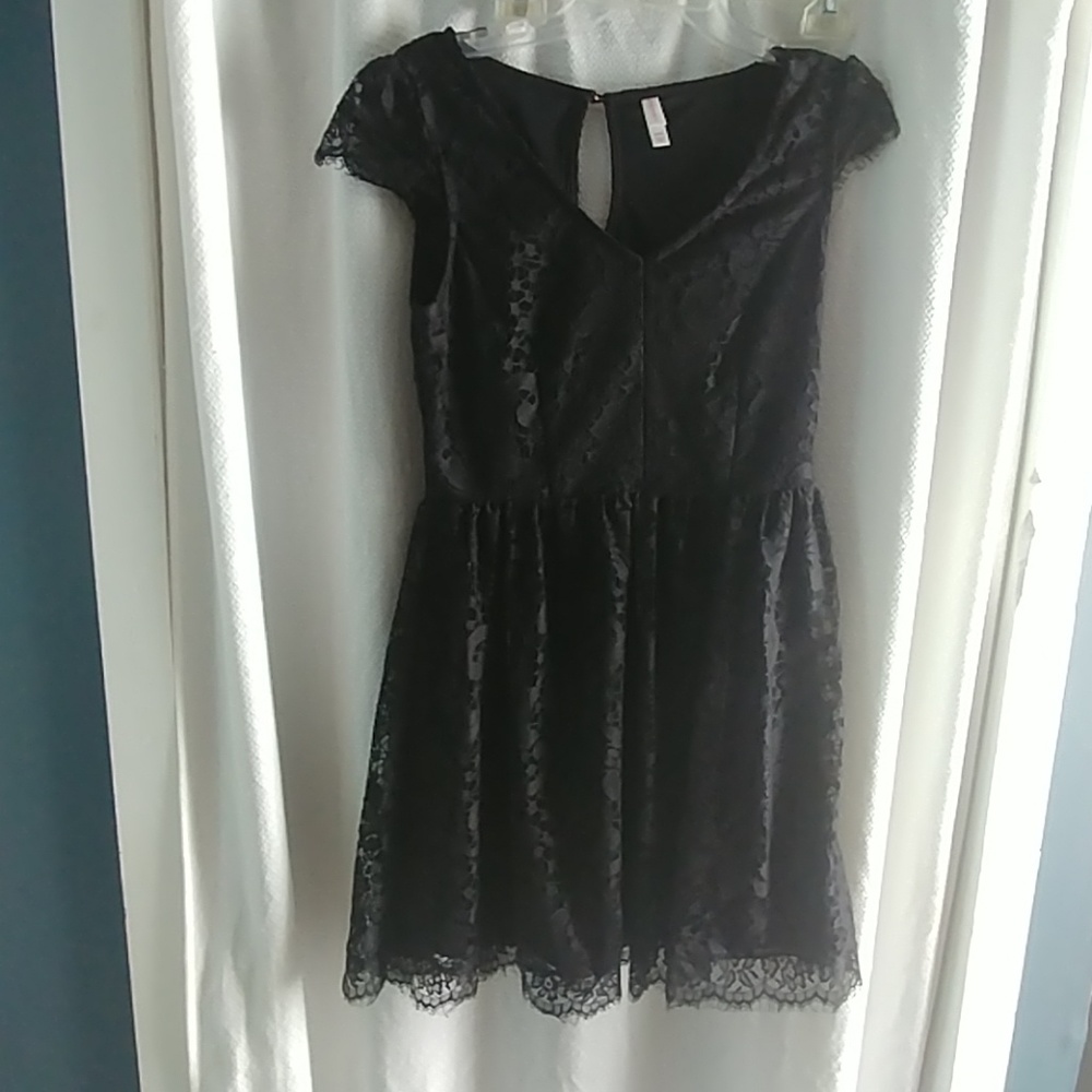 Black knee length lace dress with cap sleeves